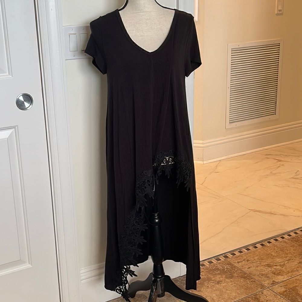 So soft asymmetrical high low top. Cute lace trim.